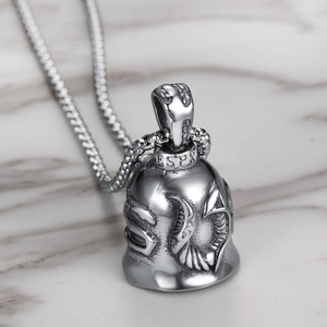 Detail view of S925 silver bell pendant with ram head relief on box chain necklace