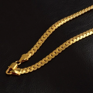 5mm 18K gold plated flat curb link necklace with lobster clasp on black leather background