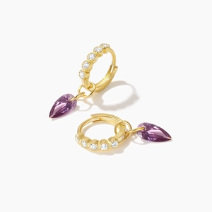 Detail of S925 silver 18K gold earrings featuring purple pear-cut drop stones