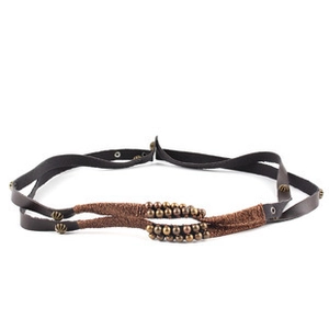 Detail view of ethnic braided jute rope belt with vintage bull head and metal beads