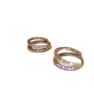 Minimalist double hoop zircon earrings in golden finish on a clean white background