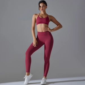 Detail of burgundy seamless yoga set featuring a U-neck sports bra and high waist leggings