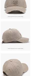 Detail showing 3D letter embroidery and vintage distressed brim on the khaki baseball cap