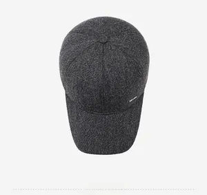 Top view of thick heather grey wool baseball cap with rectangular metal side plaque