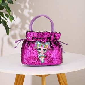 Detail of sequin kids handbag featuring cartoon doll character and drawstring closure