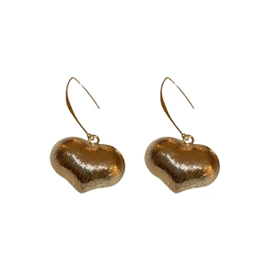 Vintage golden heart earrings with brushed metal texture in a minimalist style
