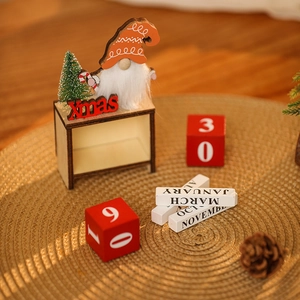 DIY wooden Christmas gnome countdown calendar with red hat and numbered blocks