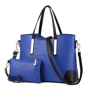 Blue crocodile pattern faux leather tote bag set with black handles and gold hardware