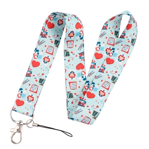 Detail of medical theme lanyard with heart and nursing icons on light blue fabric