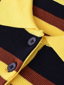 Detail of striped knit Polo shirt featuring high-density texture and premium buttons