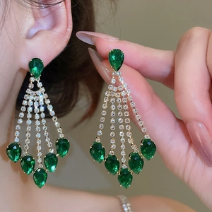 Elegant gold earrings with green teardrop gemstones and long tassels for women