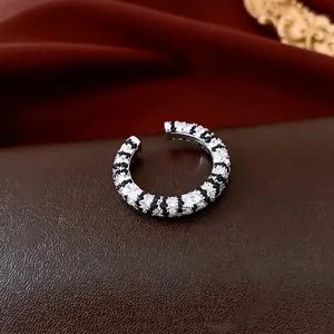 French vintage silver ring with black and white zircon stripes in an open design