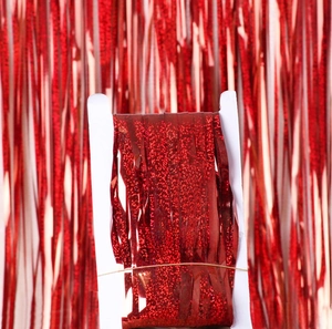 Macro shot of red laser tinsel curtain wrapped on card for party decoration