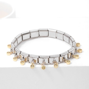 Elegant stainless steel link bracelet with gold charms on white display stand