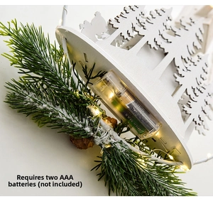 Detail of wooden Christmas tree decor with LED lights and battery compartment view