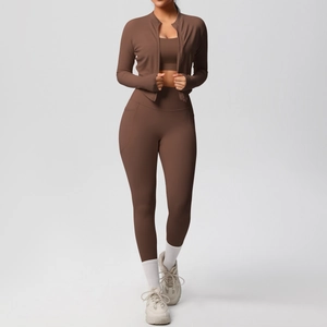 Detailed view of mocha brown three-piece yoga set featuring side pockets and zip jacket