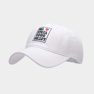 Close-up of white cotton baseball cap with MR. STEAL YOUR HEART print and red heart icon