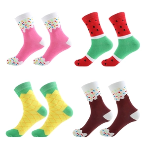 Funny mid-calf socks with colorful watermelon and pineapple fruit patterns on white background