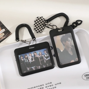 Black minimalist student ID card holder with checkerboard flower charm and retractable cord