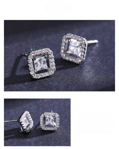 Detailed view of square halo stud earrings featuring clear cubic zirconia in s925 silver