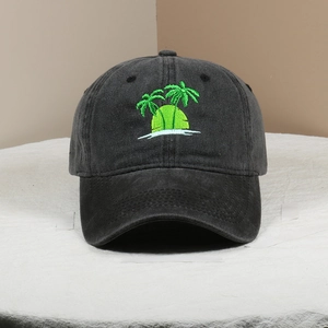 Close-up of palm tree embroidery on dark grey washed cotton vintage baseball cap