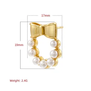 Golden bow stud earrings with small white pearl wreath dangles measuring 19mm by 17mm