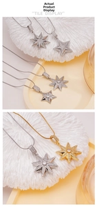 Detailed close-up of star pendants with zircon inlay on a gold and silver snake chain