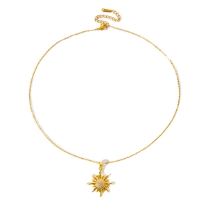Close-up of golden sun pendant with zircon inlay and S.STEEL stamp on stainless steel chain