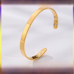 Detailed view of golden stainless steel magnetic therapy bangle with six therapy magnets