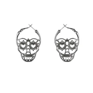 Vintage silver gothic skull earrings with heart-shaped eye hollows for a punk style look