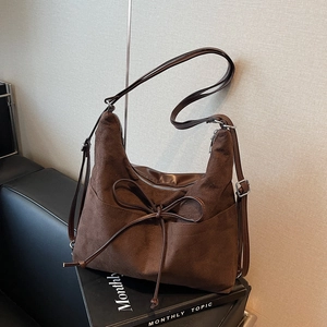 Vintage brown faux suede tote bag with large bow decoration and adjustable shoulder strap