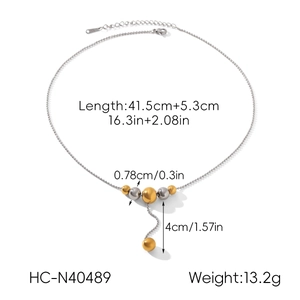 Detail view showing a two-tone beaded stainless steel necklace with dimensions and specs