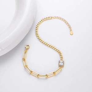 Detail of s925 silver bracelet with square zircon and thick Cuban chain link in gold finish