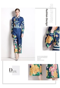 Detail of floral print cuffs and hem on navy blue long sleeve shirt and trousers set