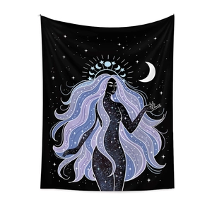 Detail of bohemian tapestry featuring a celestial goddess with star patterns and crescent moon