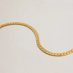 Macro view of retro 18k gold-plated titanium steel bracelet with hammered metal texture