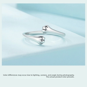 Macro shot of S925 sterling silver stamp on minimalist adjustable cat paw open ring