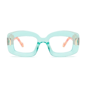 Transparent mint green square eyeglasses with amber tortoise patterned temples and metal accents