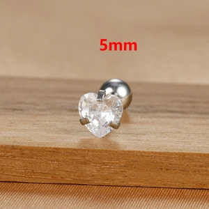 Macro shot of 5mm heart-cut clear zircon stud earring with polished silver steel base