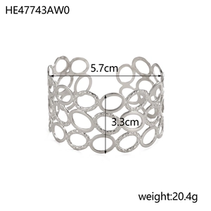 Elegant silver stainless steel cuff bracelet with geometric hollow circular patterns