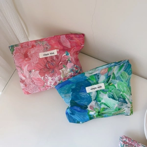 Floral print cotton makeup bags in pink and blue with simple wish label and rustic design