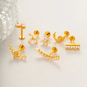 7-piece gold G23 titanium labret stud set with moon and butterfly zirconia designs