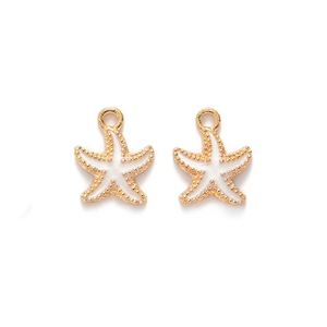 Detailed view of two gold starfish alloy pendants with white enamel for jewelry making