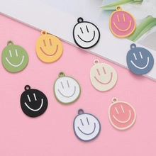 Macro shot of colorful enamel smiley face charms for DIY jewelry making accessories
