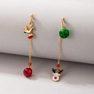 Detail of Christmas earrings featuring red and green bells with gold reindeer charms