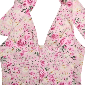 Close-up of pink rose floral print and button-front deep V-neck sleeveless top detail
