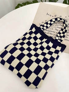 Knitted checkerboard tote bag for women featuring black and white woven texture