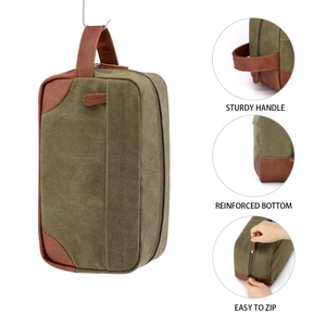 Detail views of vintage canvas wash bag with sturdy handle and reinforced bottom.