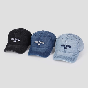 Three washed denim baseball caps in black, navy, and light blue with 3D letter embroidery