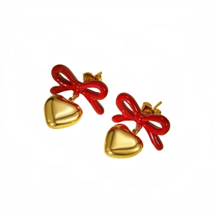 Fashionable 18K gold stainless steel earrings with red bow and gold heart pendants